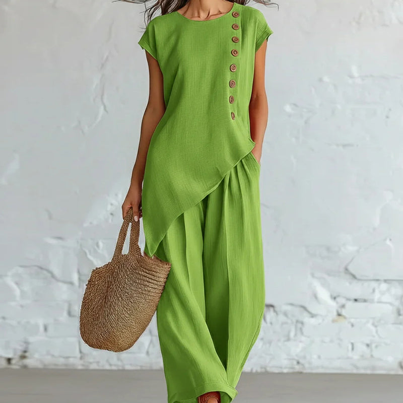 Damesset bestaande uit een top en een broek met asymmetrische zoom, 2-delig