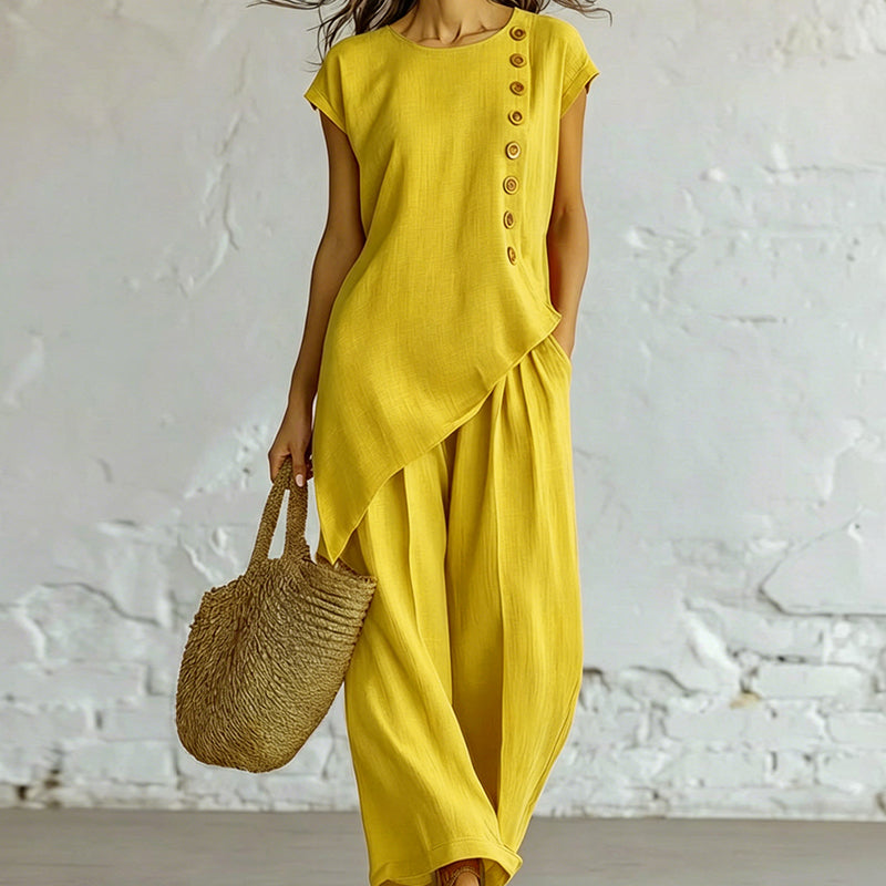 Damesset bestaande uit een top en een broek met asymmetrische zoom, 2-delig