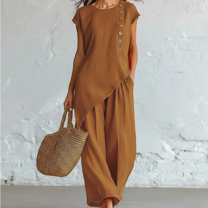 Damesset bestaande uit een top en een broek met asymmetrische zoom, 2-delig