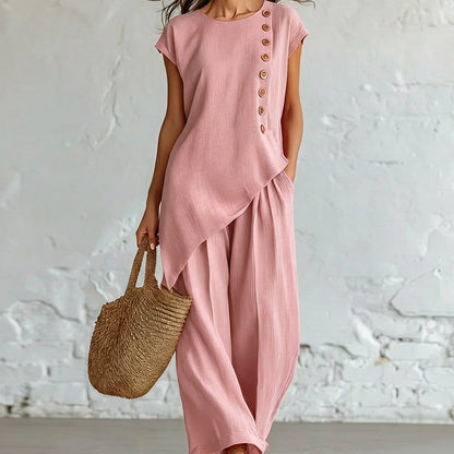 Damesset bestaande uit een top en een broek met asymmetrische zoom, 2-delig