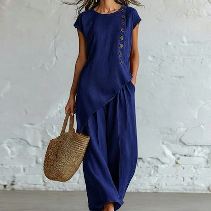 Damesset bestaande uit een top en een broek met asymmetrische zoom, 2-delig
