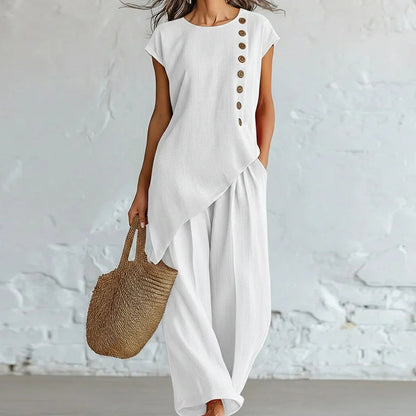 Damesset bestaande uit een top en een broek met asymmetrische zoom, 2-delig